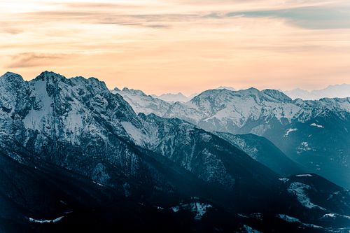 Free Majestic snowcapped mountains in Locarno, Switzerland, captured at dusk with a scenic view. Stock Photo