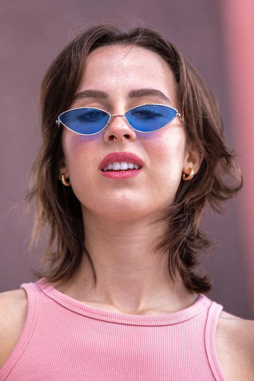 Portrait of Brunette Woman Wearing Sunglasses