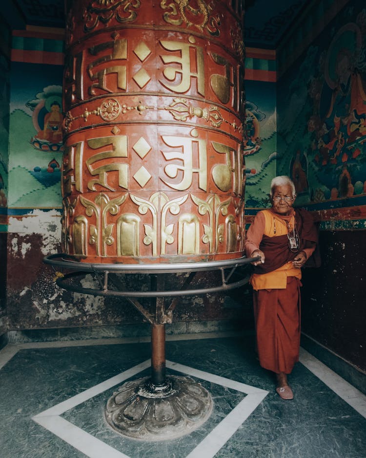 Old Monk Near Big Prayer Wheel