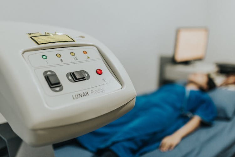 Person Lying On A Bed In A Hospital