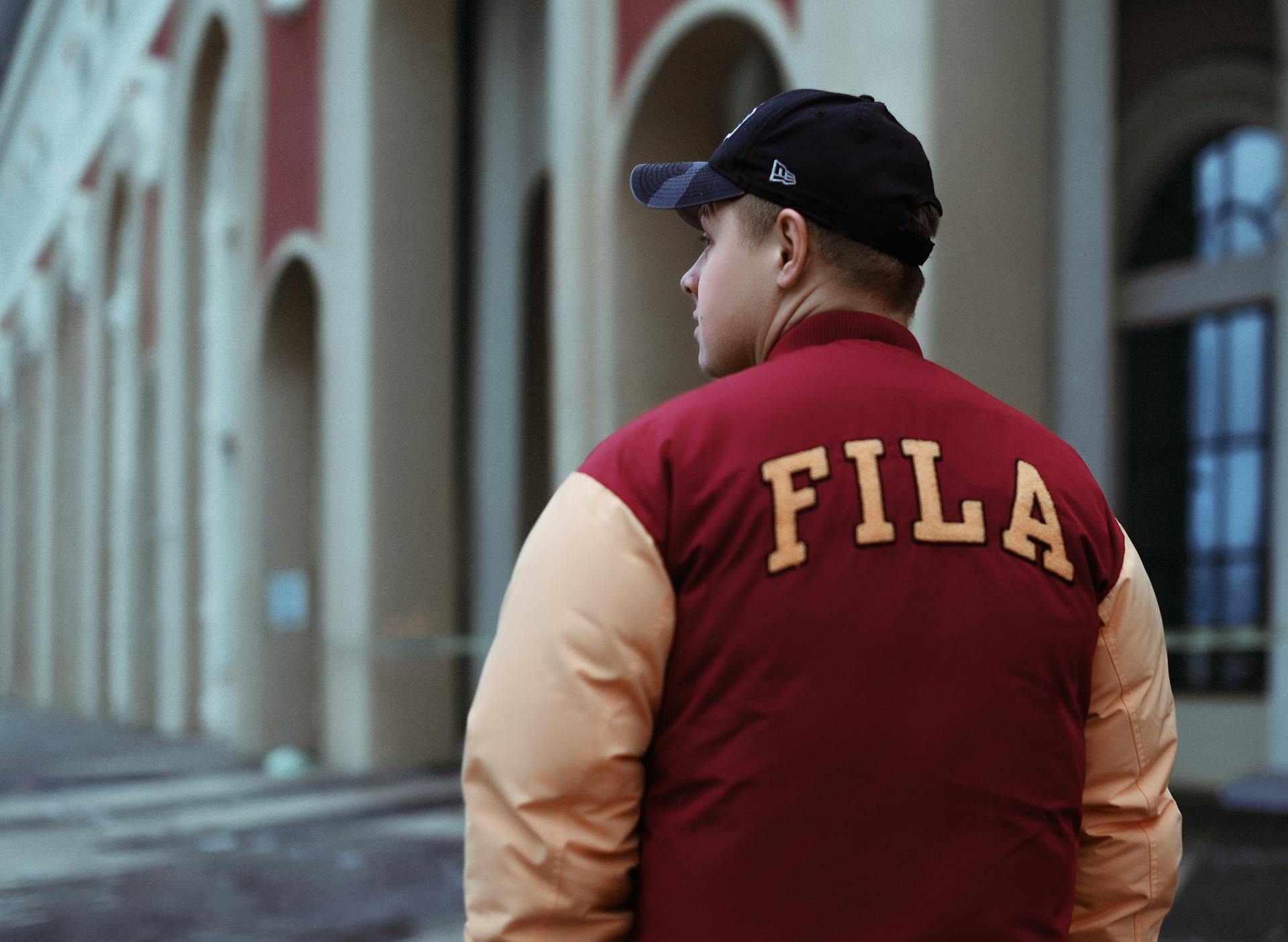 Man in Fila Jacket and Cap