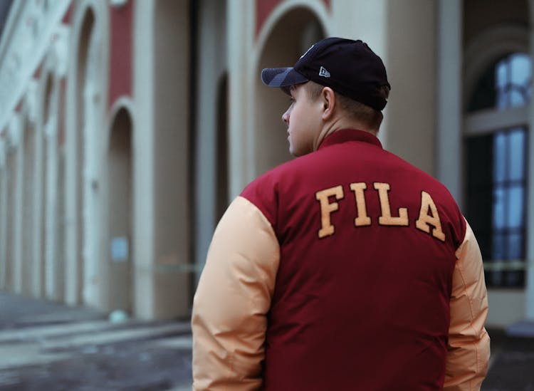 Man In Fila Jacket And Cap