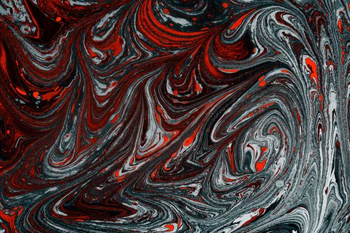 Free Vivid marbled design in red, black, and white hues creating a dynamic artistic texture. Stock Photo