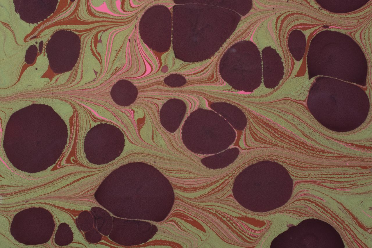 colorful abstract marbled pattern with earthy tones and circular shape