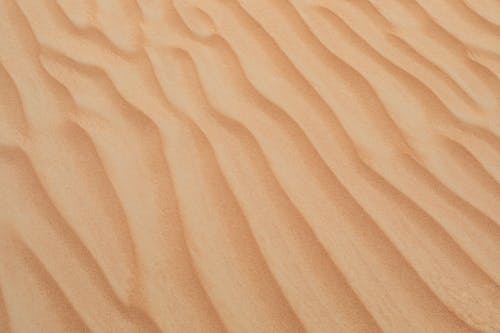 Free Wavy Patterns on the Desert Sand Stock Photo