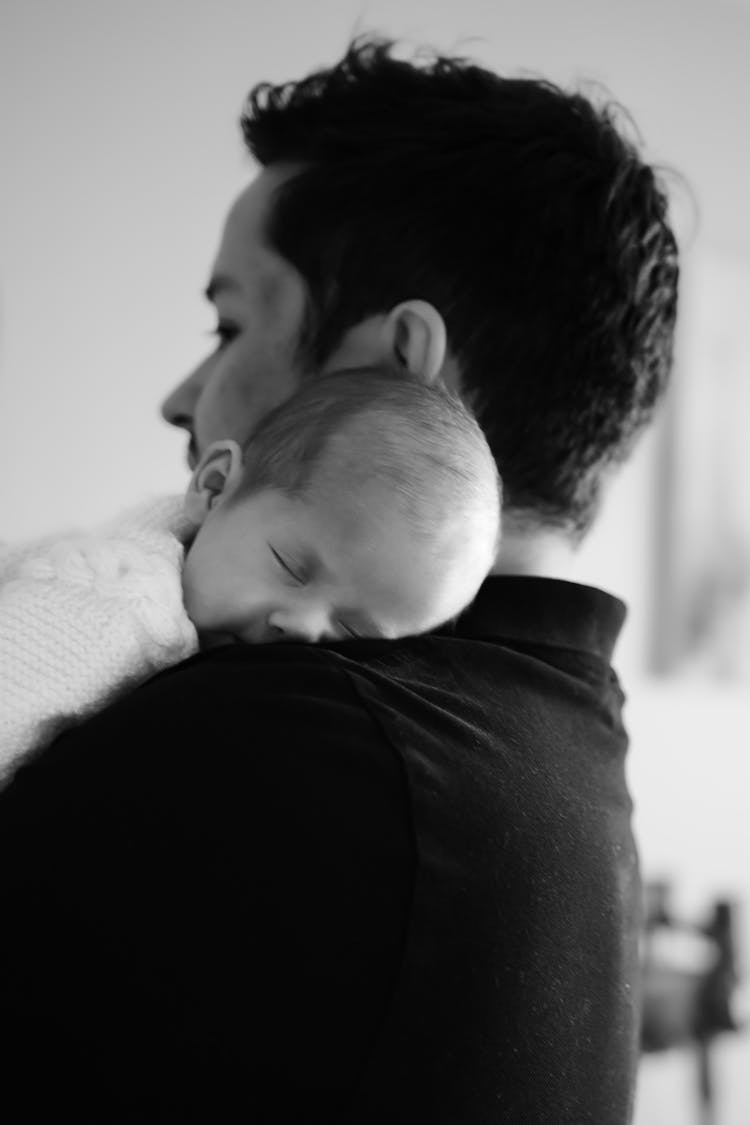 Father Holding Sleeping Baby