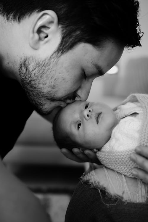 Father Kissing Baby