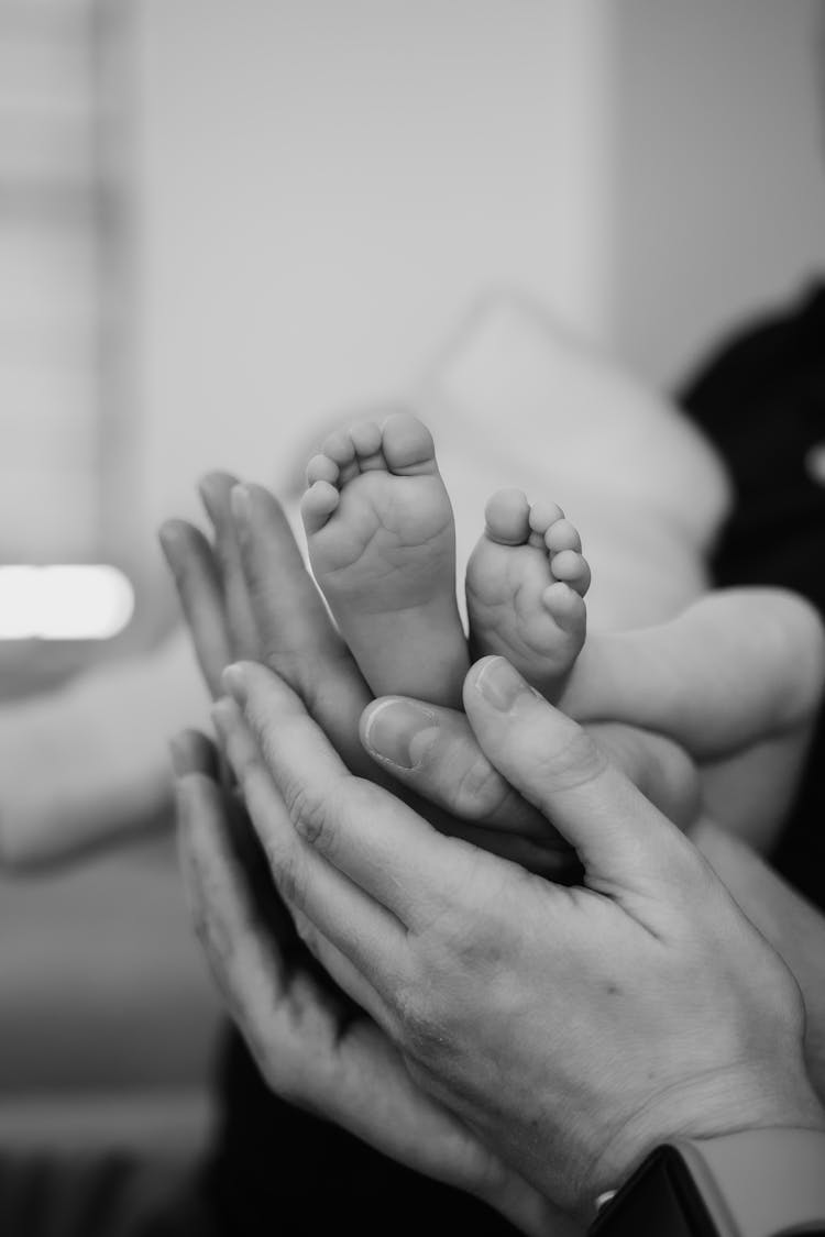 Hands Touching Baby Feet