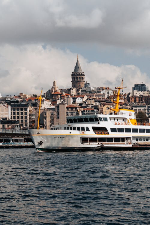 Ferry Sailing on Istanbul Coast with Galata Tower behind