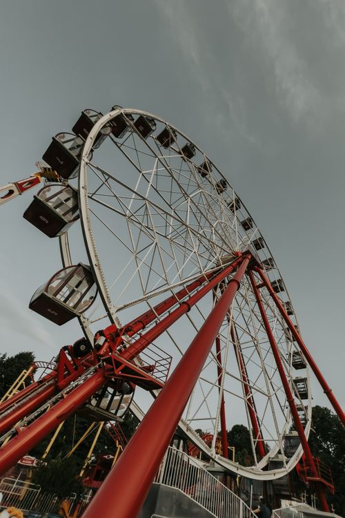 Free Low angle view of a Ferris wheel at sunset in an amusement park in Bursa, Türkiye. Stock Photo