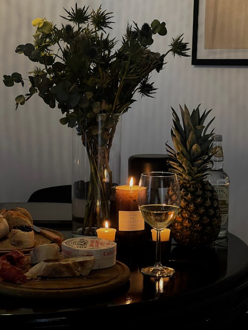 Wine and Snack on Table with Candlelight at Home