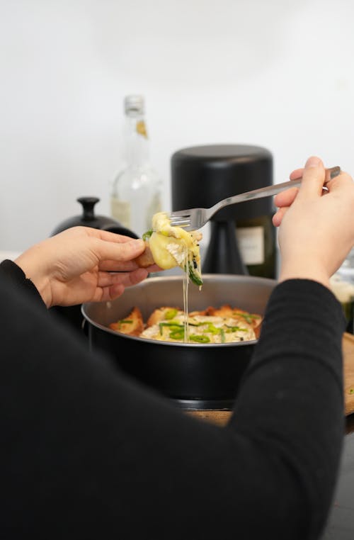 A Person Holding a Fork