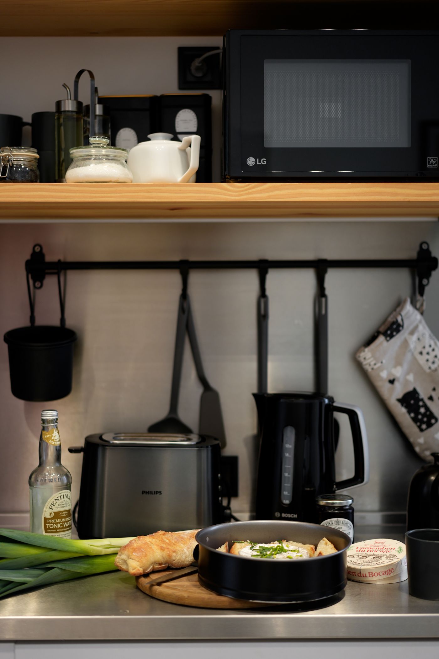 Modern kitchen worktop with cooking appliances and fresh ingredients arranged for everyday meal preparation