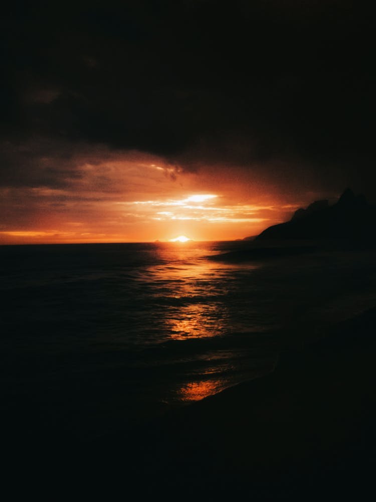 Storm Clouds At Sunset Over Sea