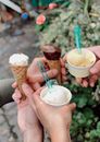 Four Persons Holding Ice Cream