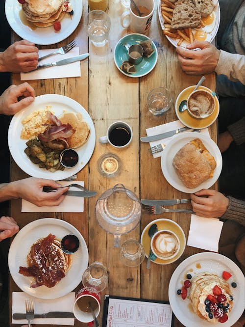 Photo Of People Having Dinner Together