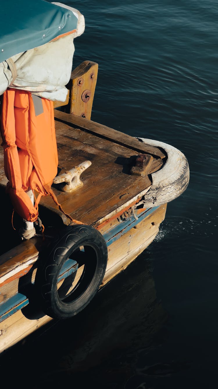 Stern Of A Wooden Boat On Water