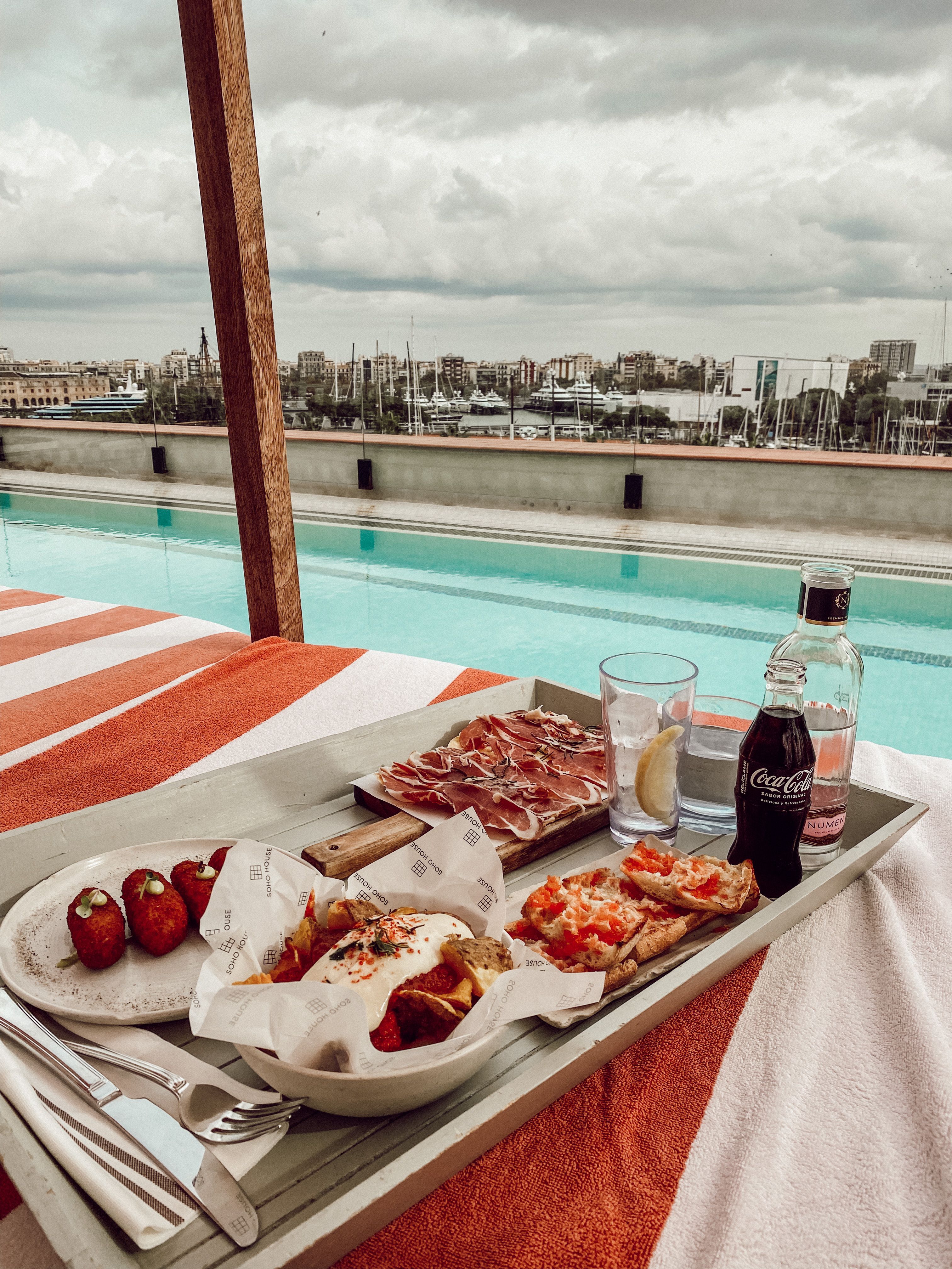 A Tray of Delicious Food on the Table Beside the Swimming Pool · Free ...