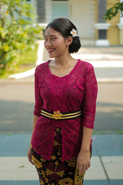 Smiling Woman in Pink Clothes