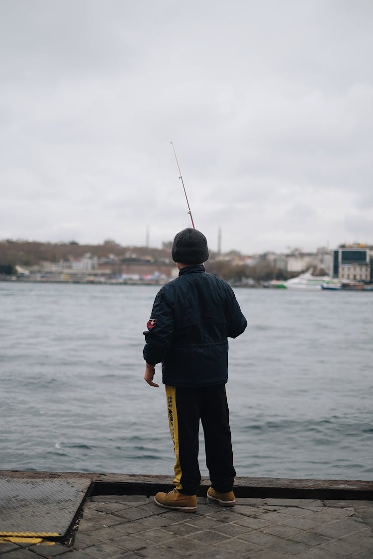 A Person Fishing On The River