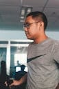 Man Wearing Gray and Black Nike Crew-neck Shirt