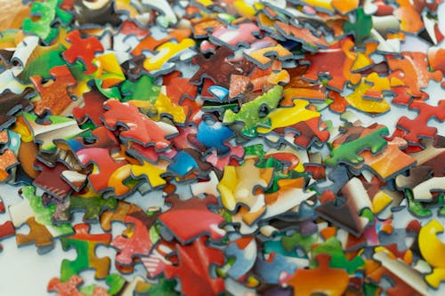 Colourful puzzle pieces in a pile
