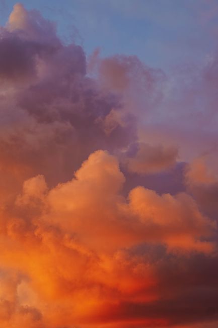 Stunning sunset cloudscape in Martil, Morocco with vibrant hues of orange and purple.