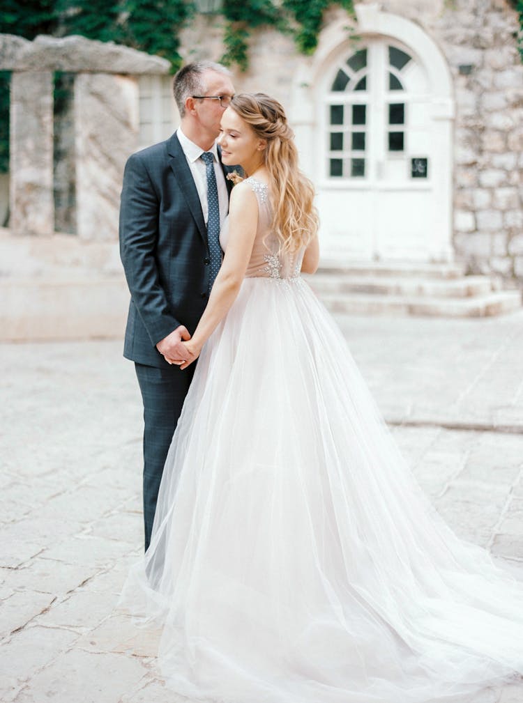 Young Bride And Groom Holding Hands 