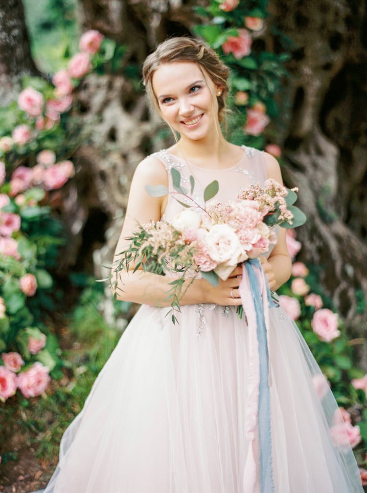 Smiling Bride Holding The Bouquet 