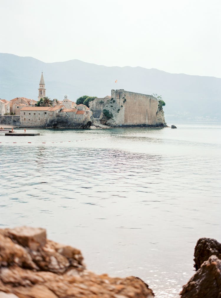 Old Stone Buildings On Rock On Seashore