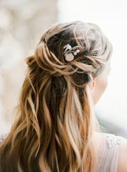Back view of a woman with long blonde hair styled elegantly featuring a decorative clip.