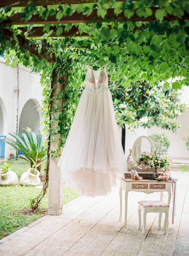 Wedding Dress Hanging On Outdoor Terrace