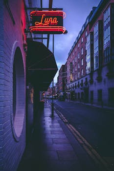 Atmospheric street scene in Dublin with neon lights at night.