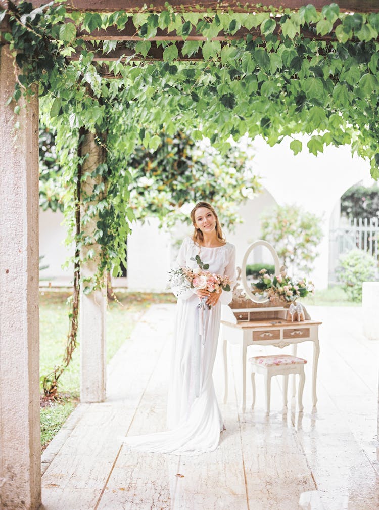 Happy Bride Posing At Outdoor Terrace