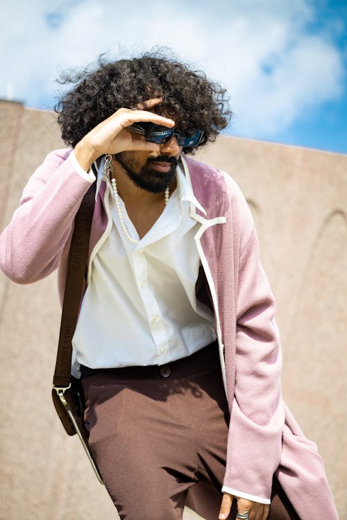 Bearded Man with Sunglasses Posing in Pink Jacket and White Shirt