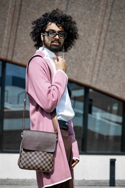 Wavy Haired Man in Pink Cardigan 