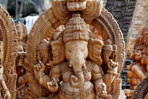 Free Detailed wooden Hindu Ganesha statues at a traditional market showcasing cultural craftsmanship. Stock Photo