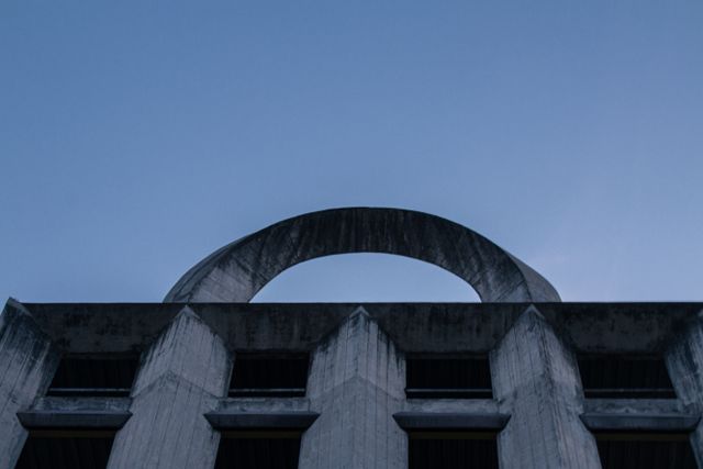 Concrete arch at dusk — photo by Nairod Reyes on Pexels