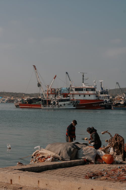 People with Bags in Sea Port