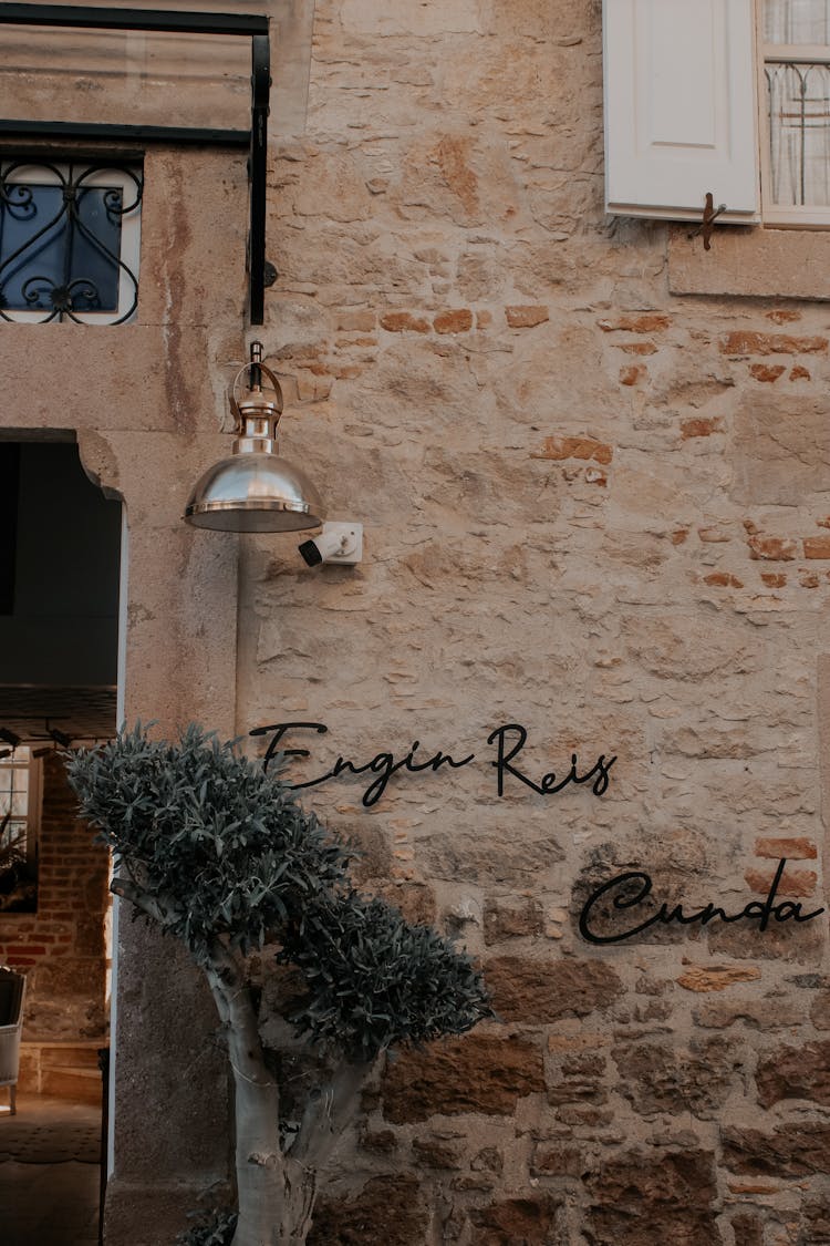 Minimalist Lettering Sign On Building Brick Wall