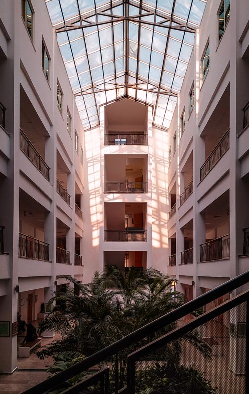 Free Sunlit atrium in Denizli, Türkiye with a modern design featuring a glass ceiling and interior balconies. Stock Photo