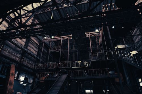 Free Low angle view of a dimly lit factory interior, showcasing industrial architecture in Pingtung, Taiwan. Stock Photo