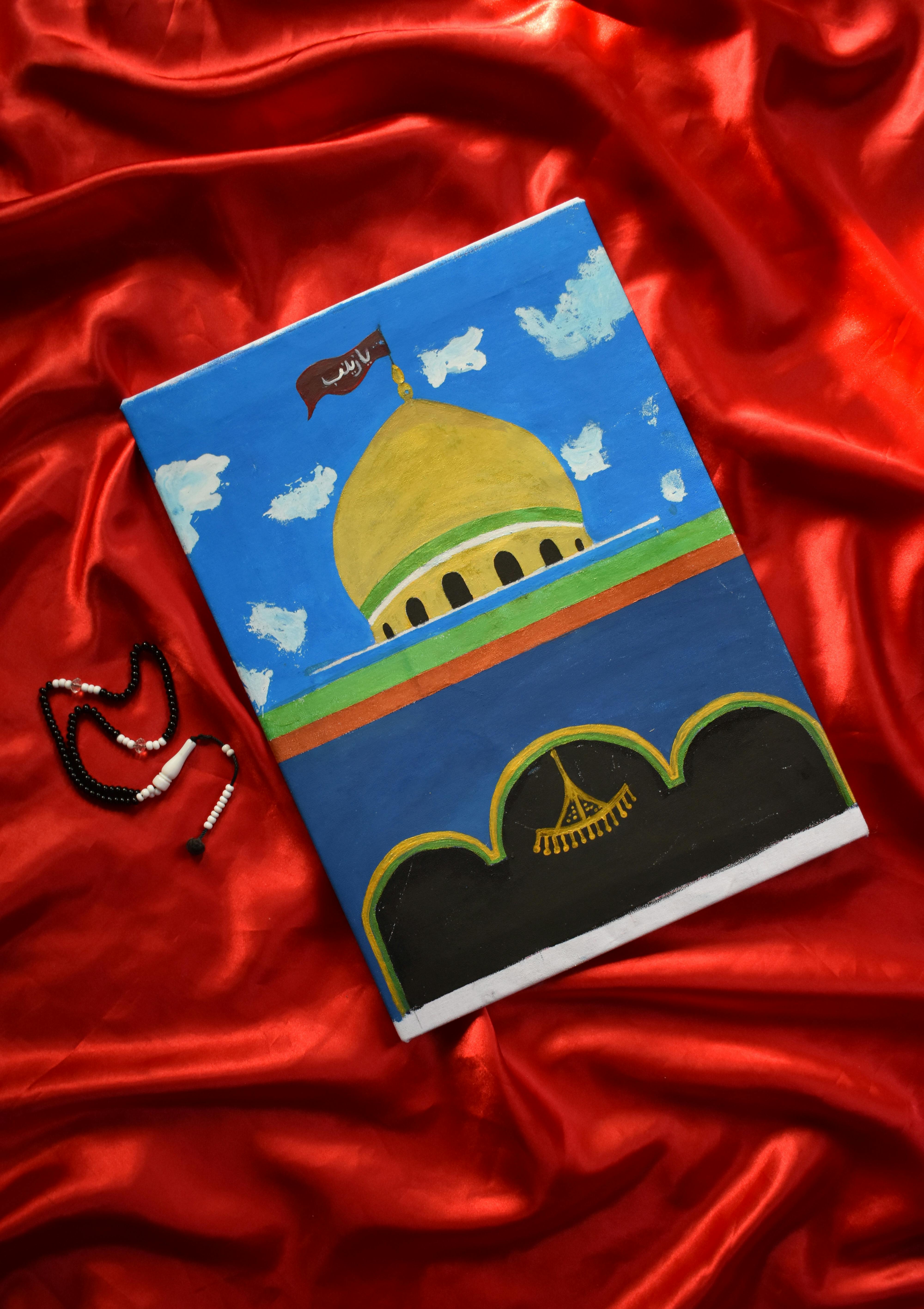 Colorful mosque painting with beads on vibrant red fabric, top view.