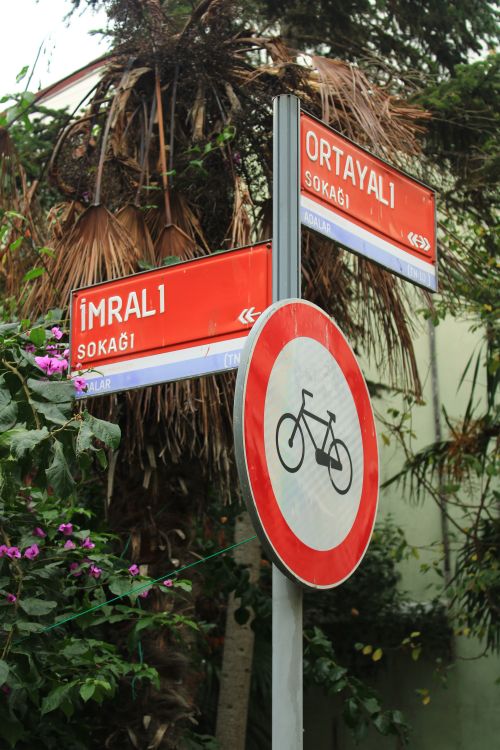 Free Close-up of a 'No Bicycles' sign and street signs on Heybeliada, İstanbul, Turkey. Stock Photo