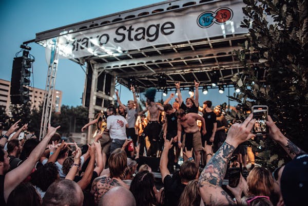 Outdoor festival crowd enjoying live music