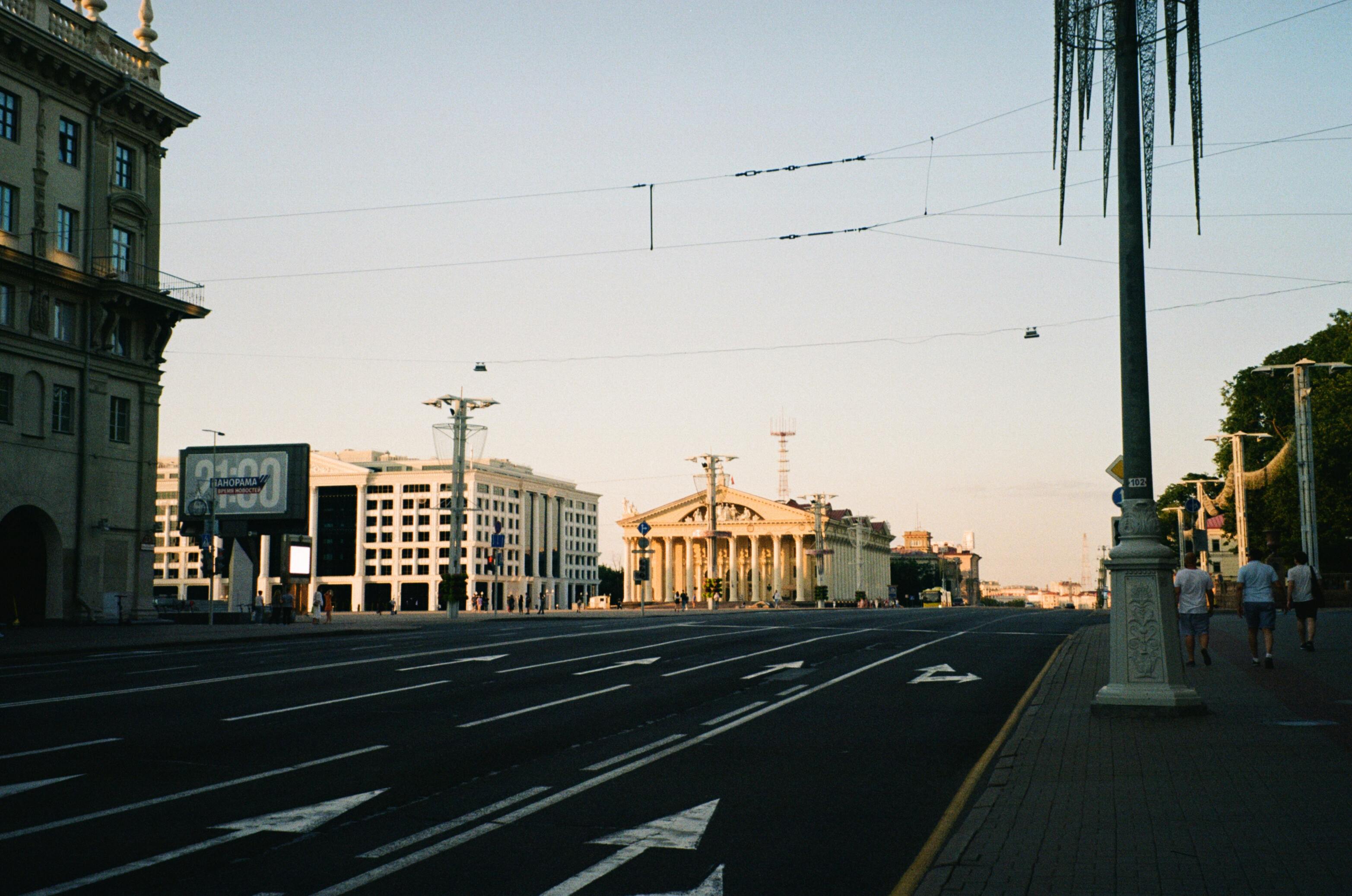 Cityscape of Minsk, Belarus, showcasing architecture and empty streets during early morning.