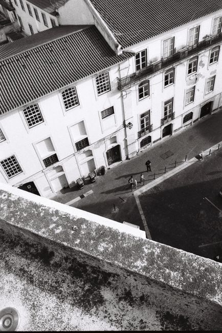 Aerial view of an urban courtyard in Lisbon, Portugal featuring classic architecture.