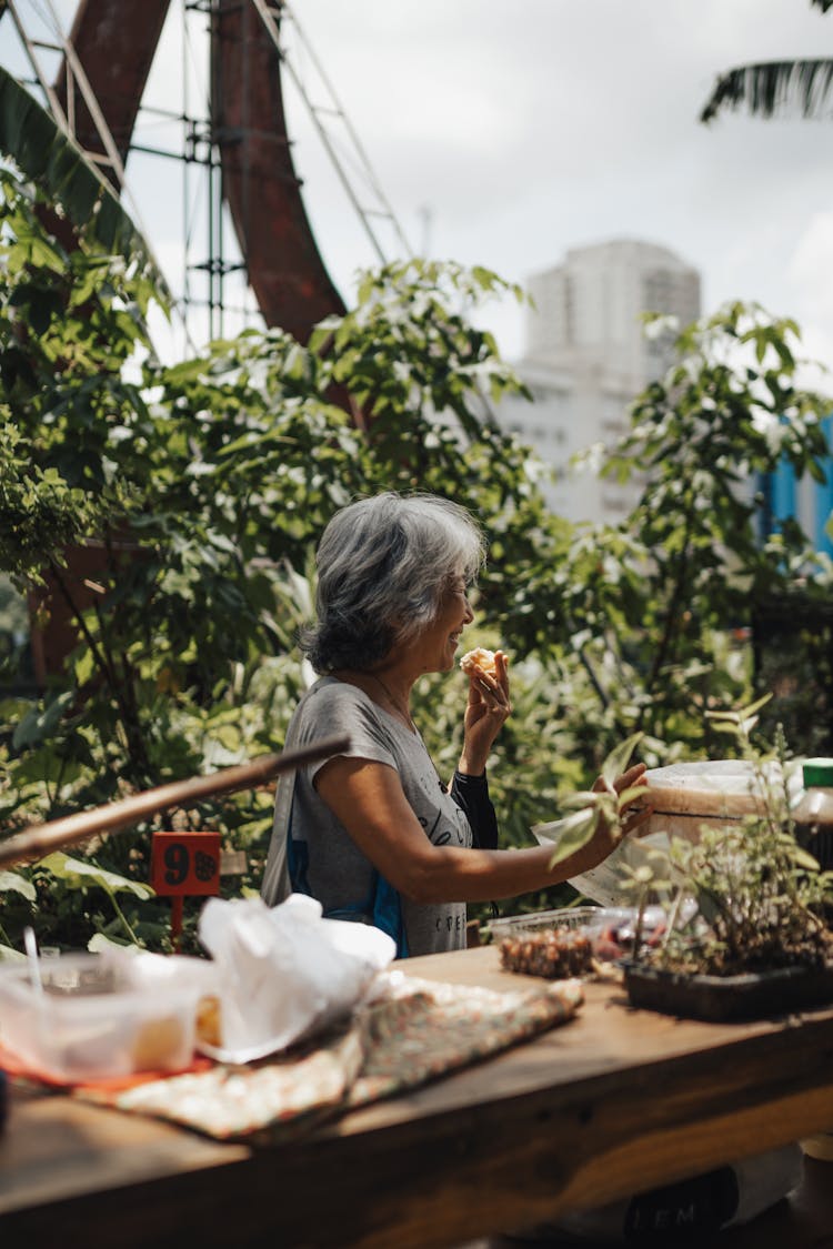 Elderly Woman In A Garden 