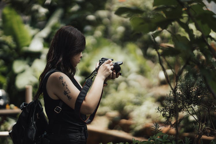 Woman Photographing Plants 