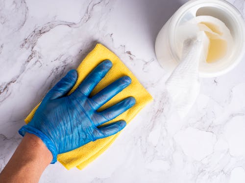 Man Cleaning a Counter Top 